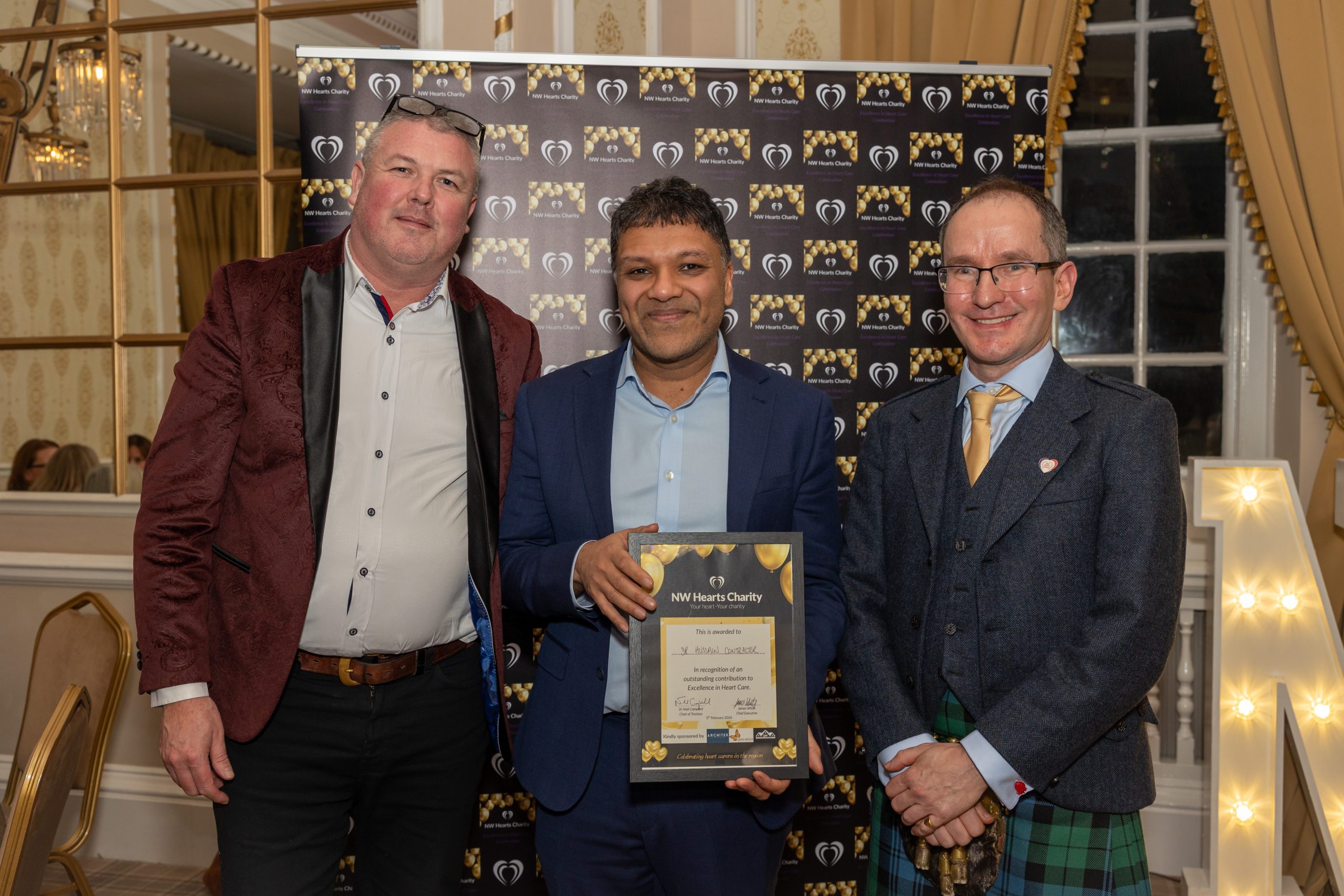 Award winner Dr Hussain Contractor with Craig Poppleton and Dr Niall Campbell