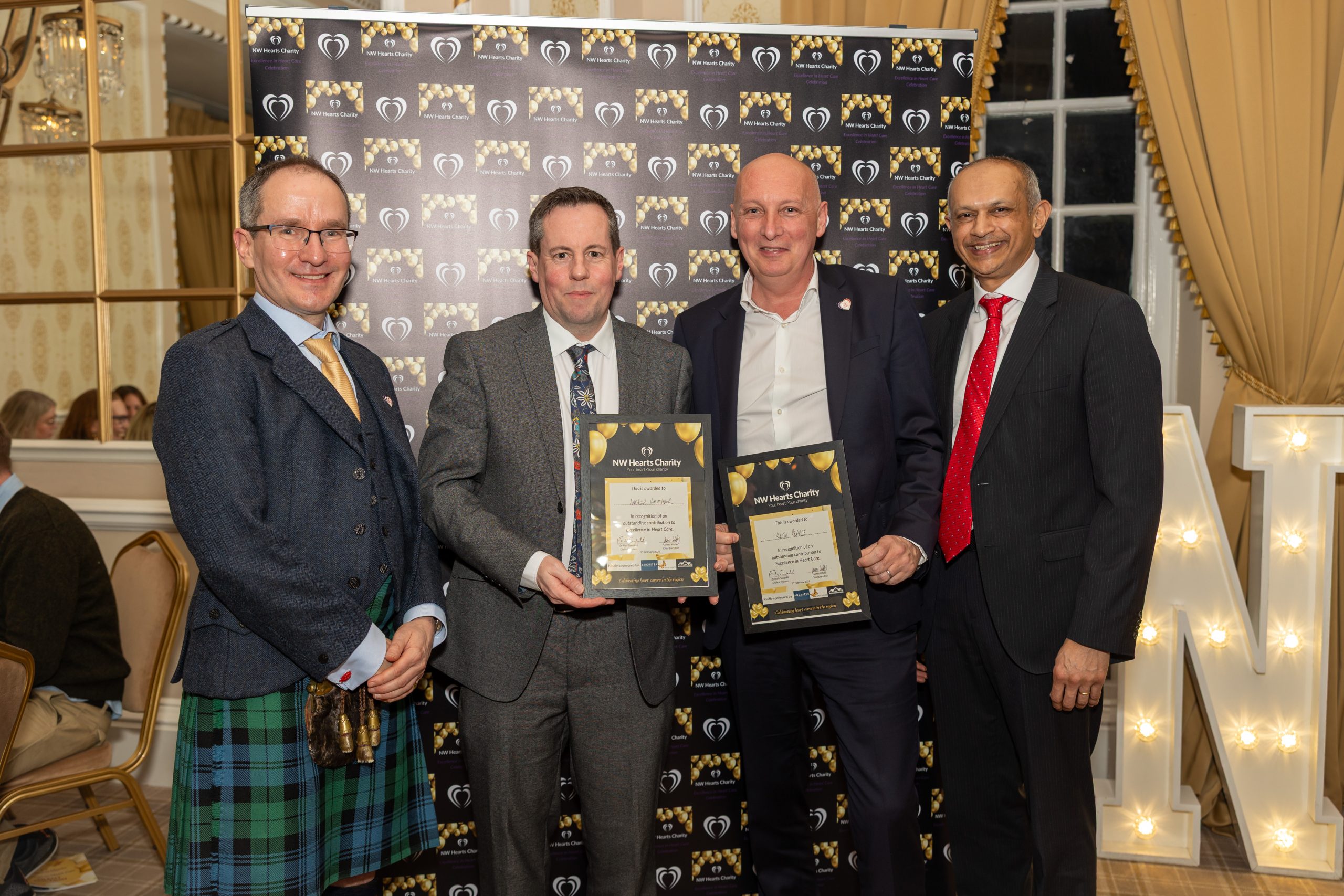 Award winners Andrew Whittaker and Professor Keith Pearce with Dr Niall Campbell and Dr Sanjay Sastry.