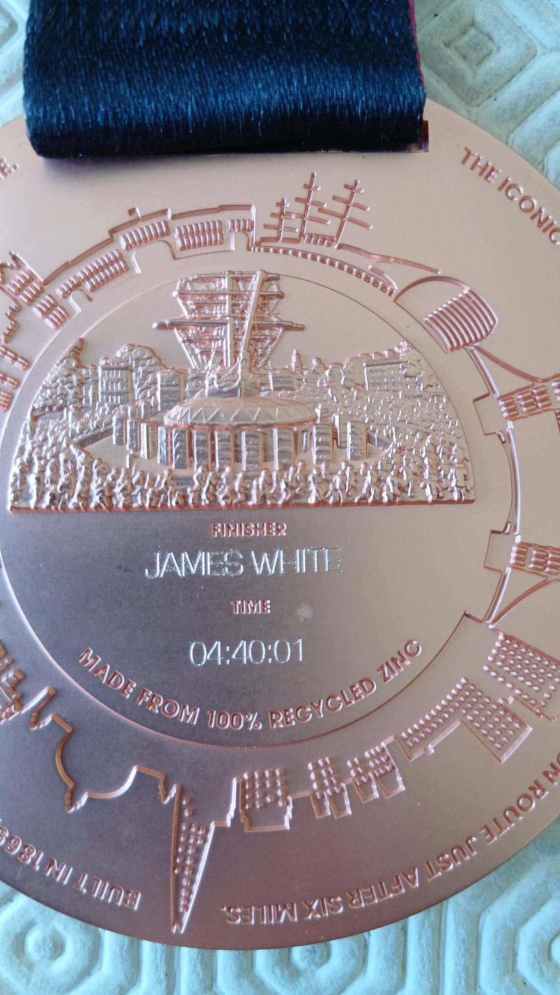 James' 2026 London Marathon medal, engraved with his time
